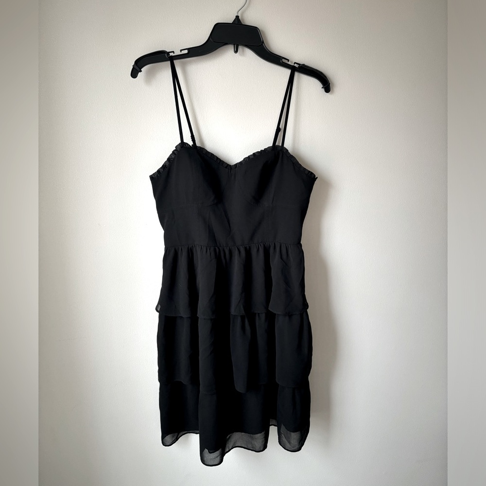 Never worn, American Eagle formal dress. Size 10. Black, chiffon/polyester.
